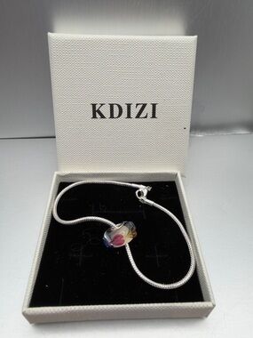 Silver snake chain bracelet and glass bead charm